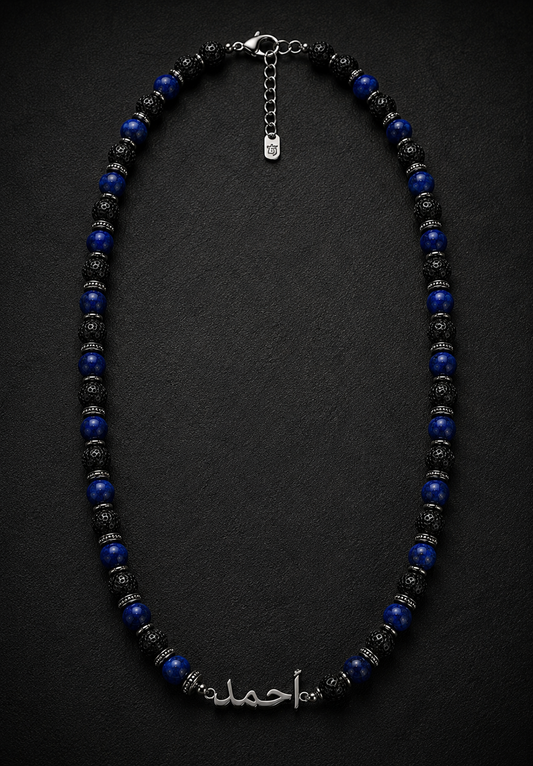 Necklace with blue and black beads on a dark background