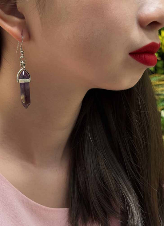 Amethyst Earrings displayed on jewelry stand
