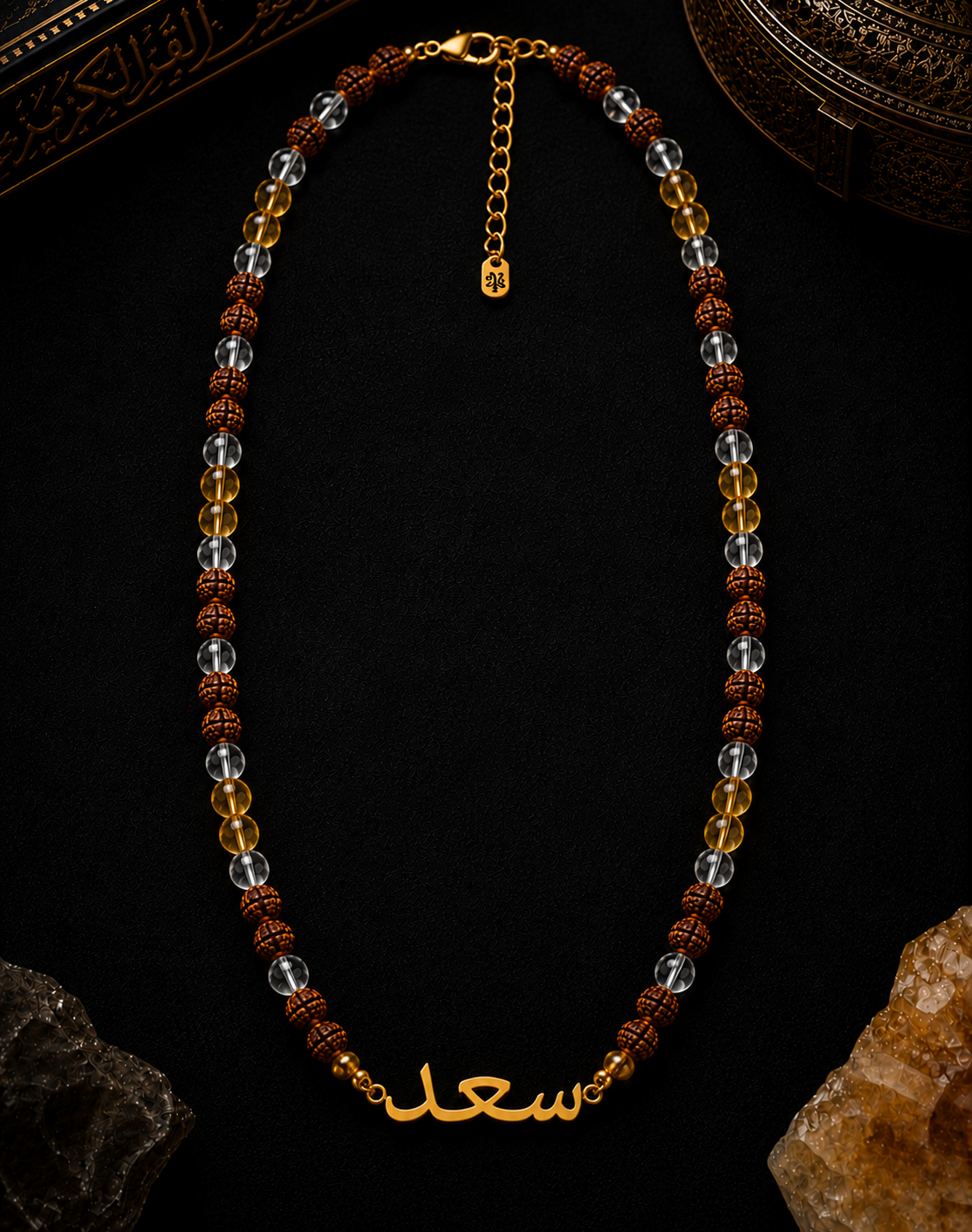 Necklace with beads and gold chain on a dark background