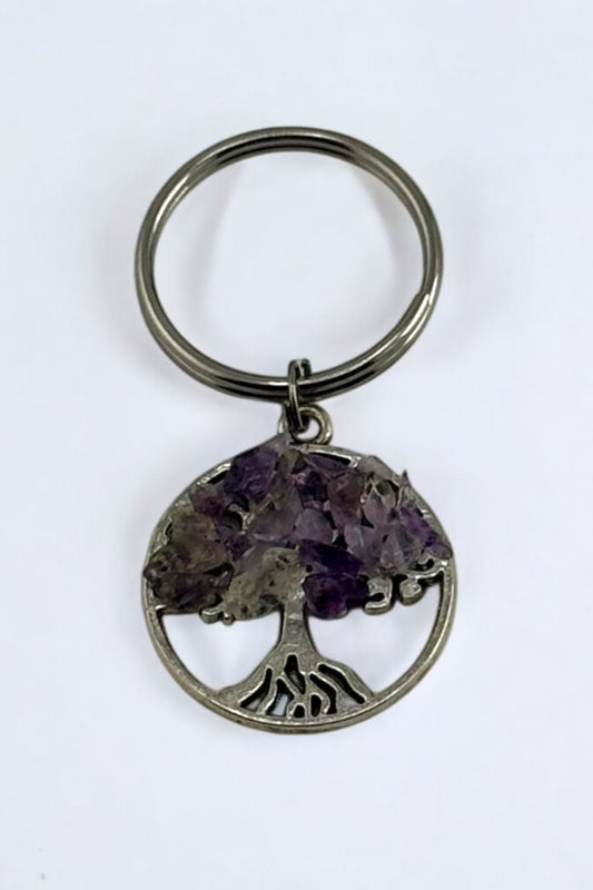 Hand holding Amethyst Tree of Life Crystal Keychain
