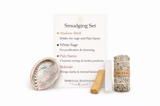 Smudging set with abalone shell, white sage, Palo Santo, and packaging on a white background