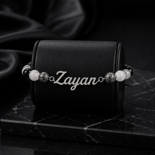 Bracelet with 'Zayan' engraving on a black leather case