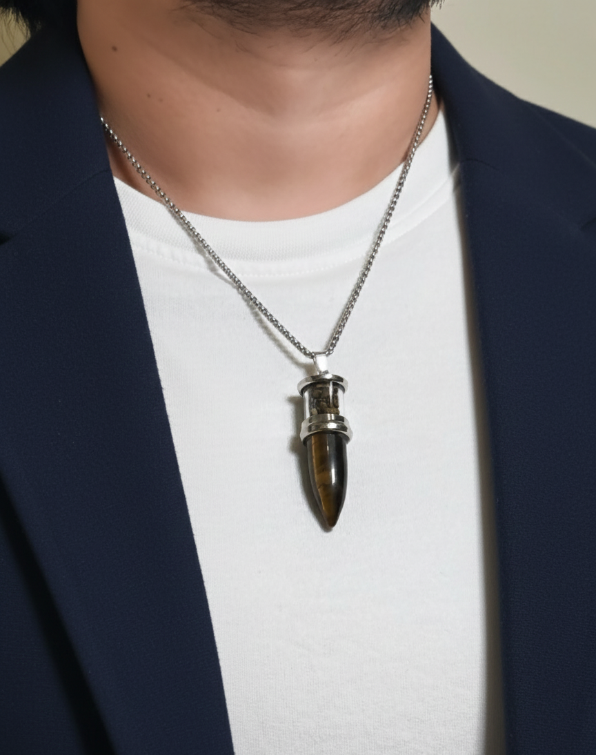 Person wearing a necklace with a unique pendant
