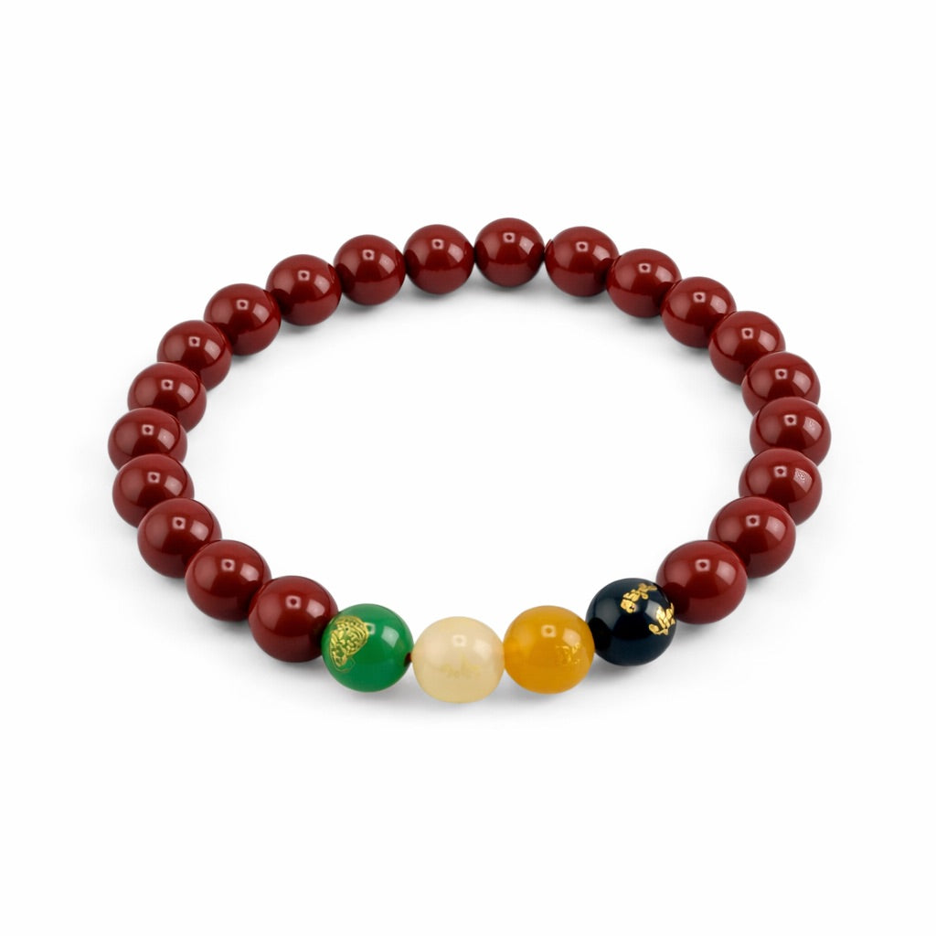 Beaded bracelet with red beads and a few colored beads on a white background