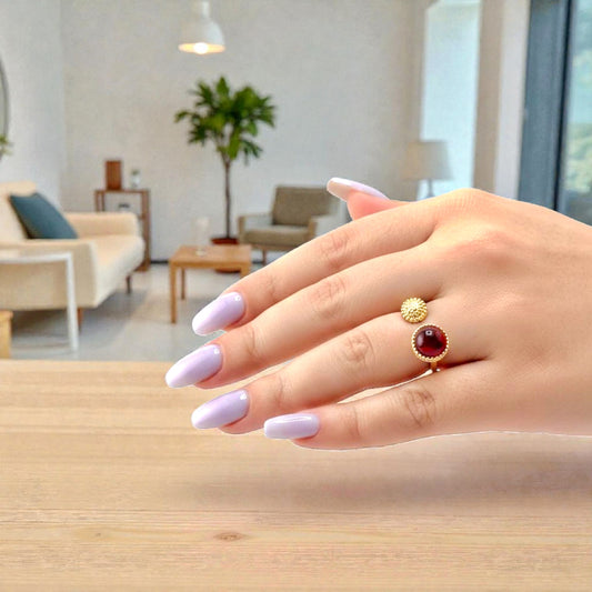 red garnet gemstone ring on display