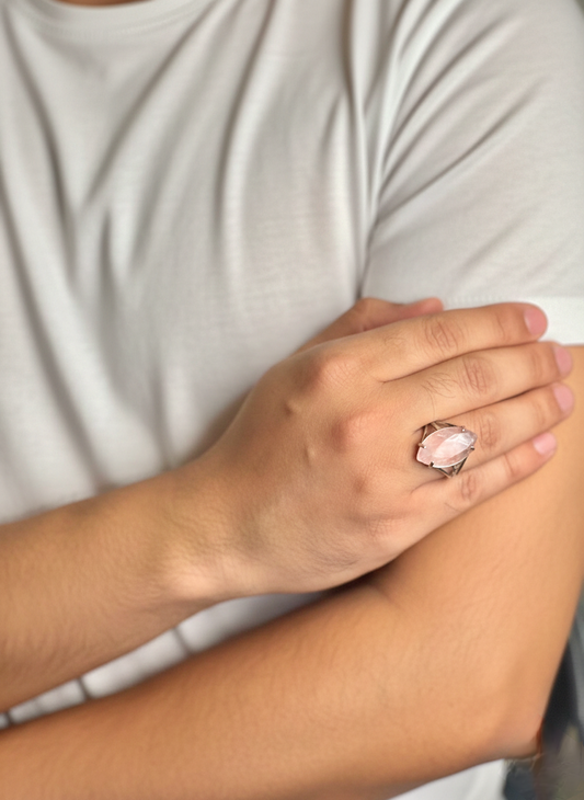 Close up of Rose Quartz gemstone ring on a man’s hand