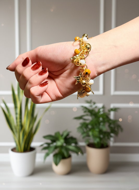 Yellow & White Beaded Gold-Tone Charm Bracelet with Star & Shell Details