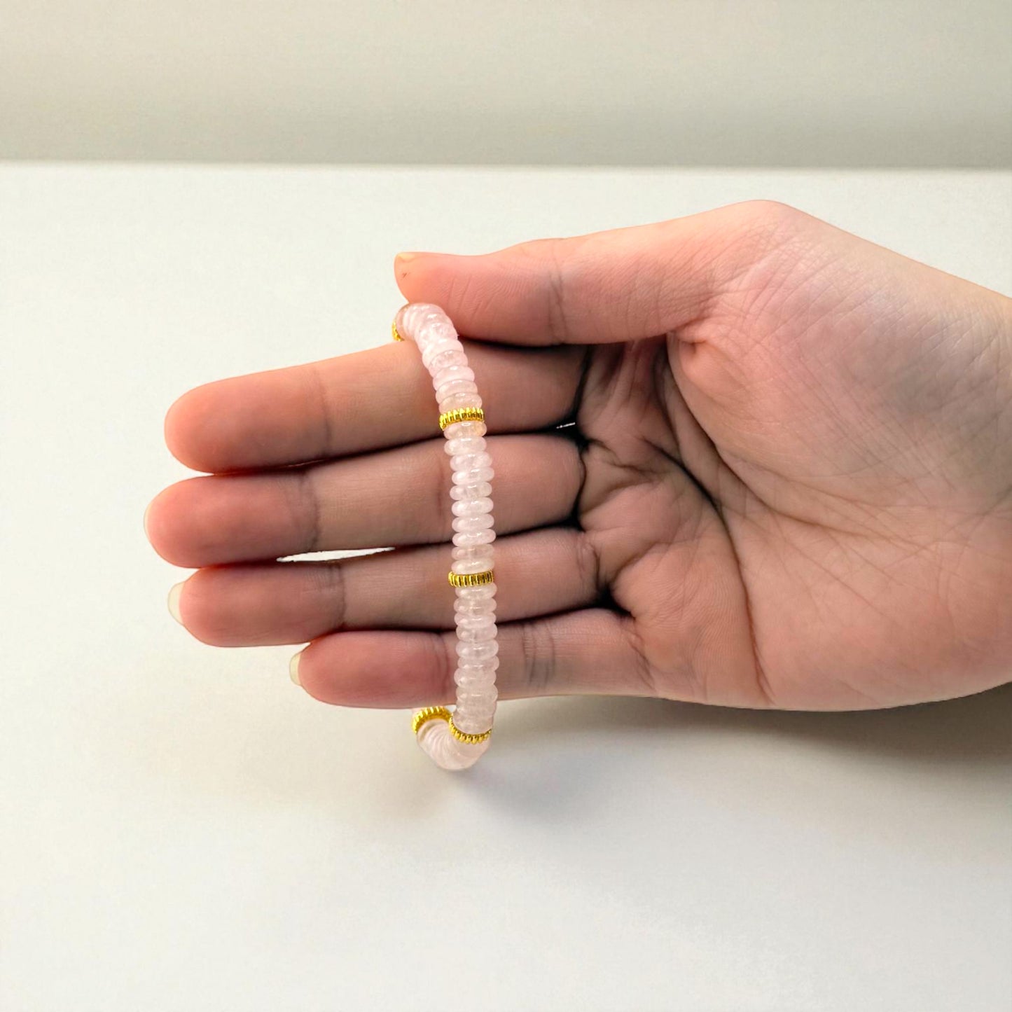rose quartz bracelet with gold spacers