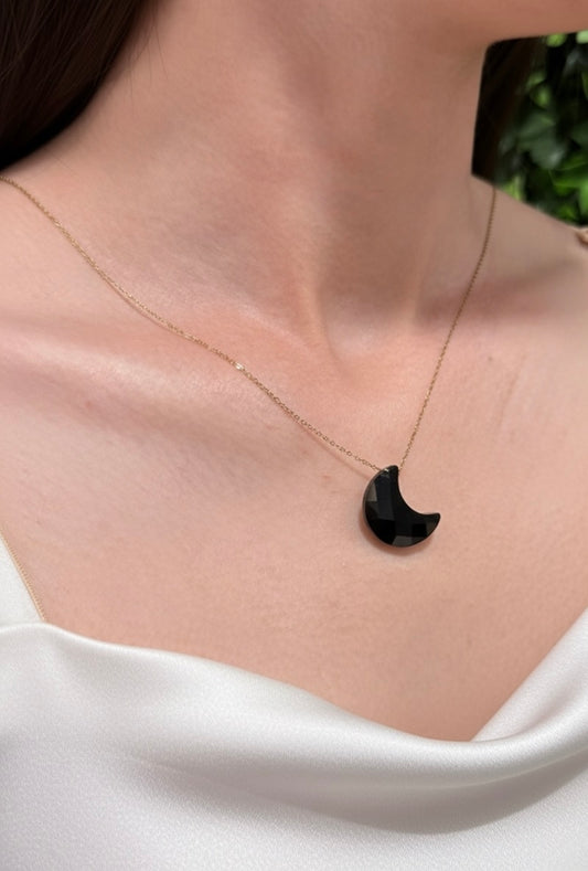 faceted black moon pendant close up