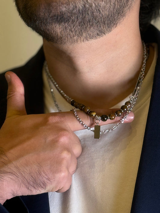 Close-up of Tiger Eye men’s necklace worn with blazer