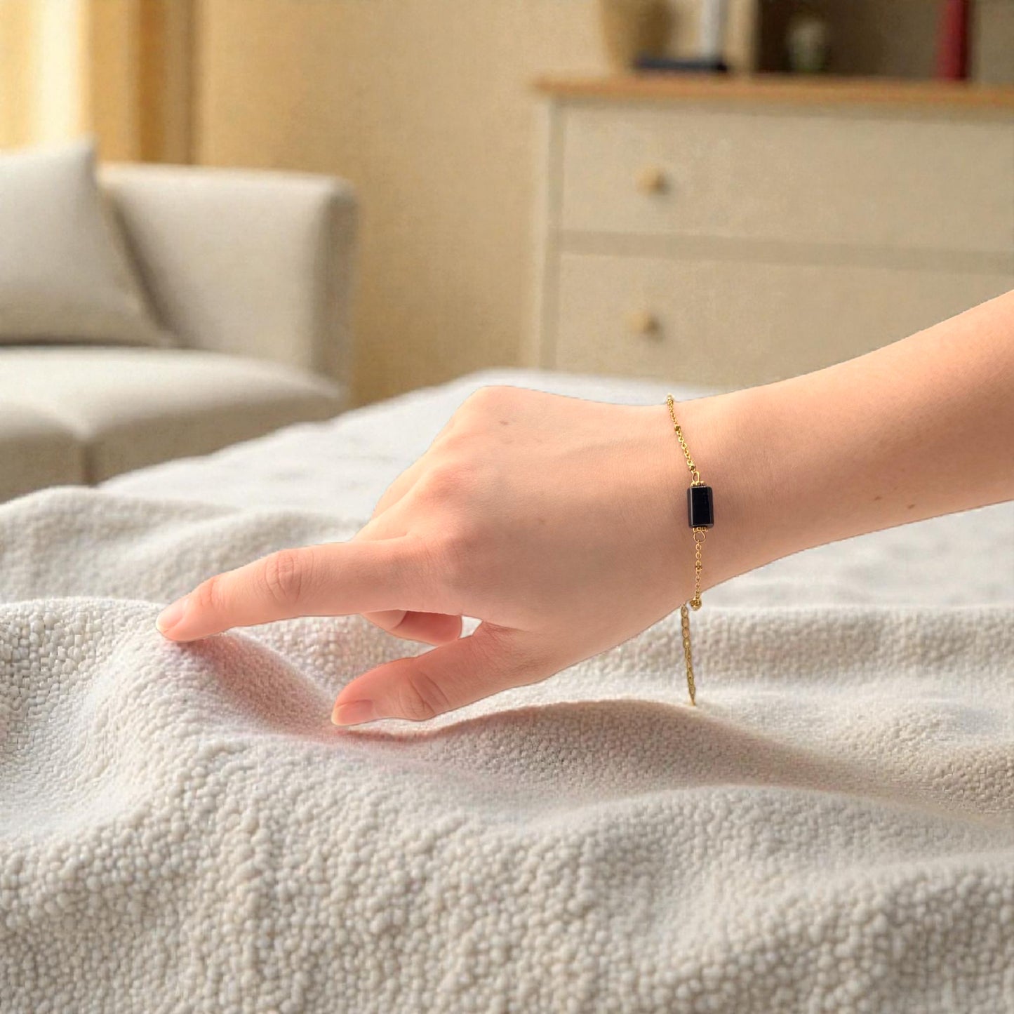 black crystal bracelet on gold chain