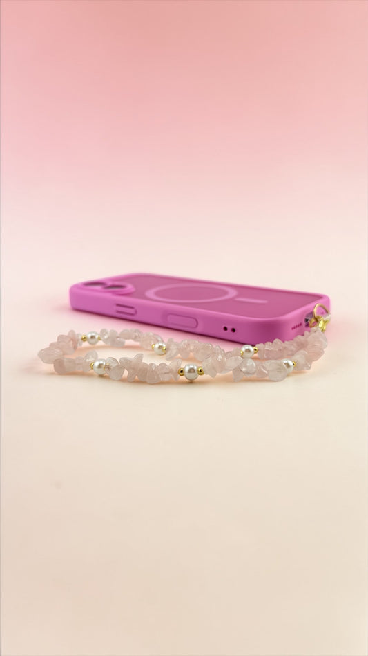 Pink phone case with a pearl design on a pink background