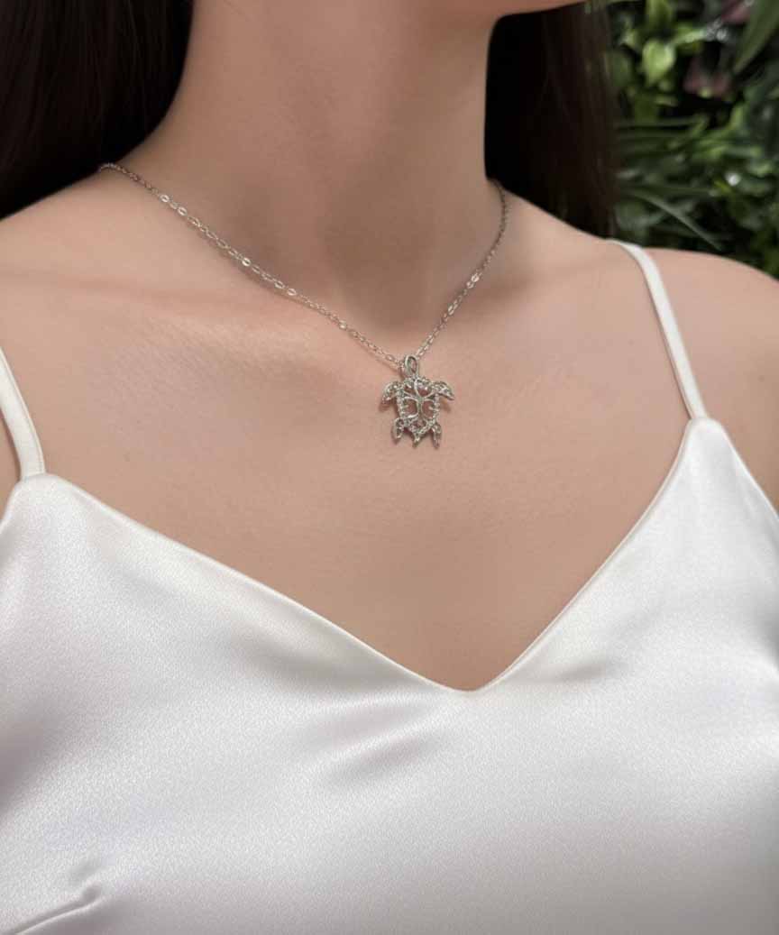 Silver Turtle Pendant Necklace – elegant women’s sea turtle necklace in shimmering silver.