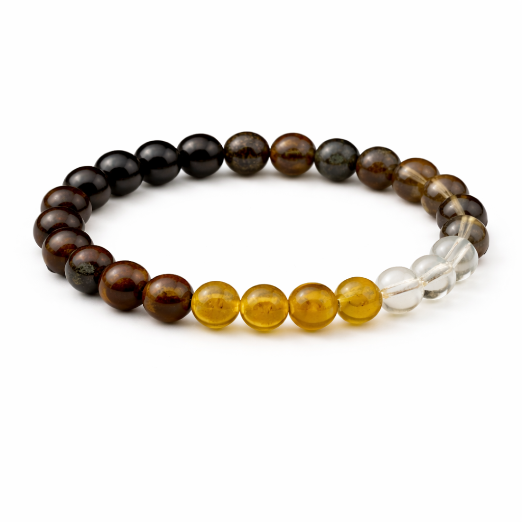 Beaded bracelet with brown, yellow, and clear beads on a white background