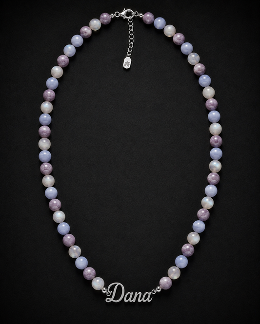 Necklace with multicolored beads and 'Dana' clasp on a black background