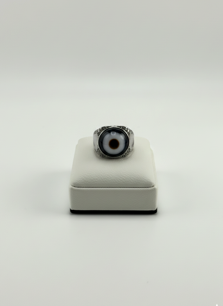 Natural evil eye Agate gemstone ring displayed on prop