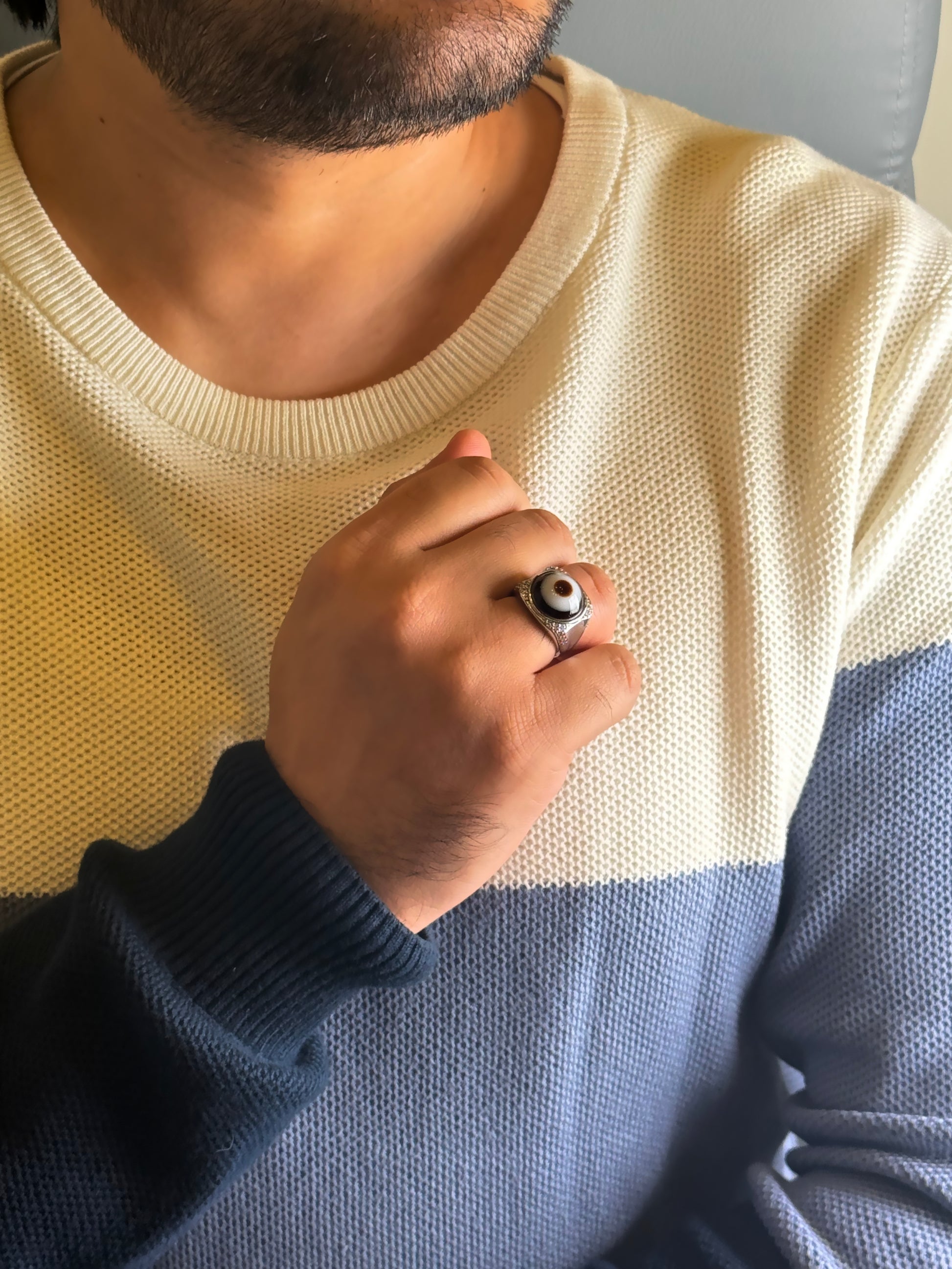 Man wearing Evil Eye Agate male ring in silver finish