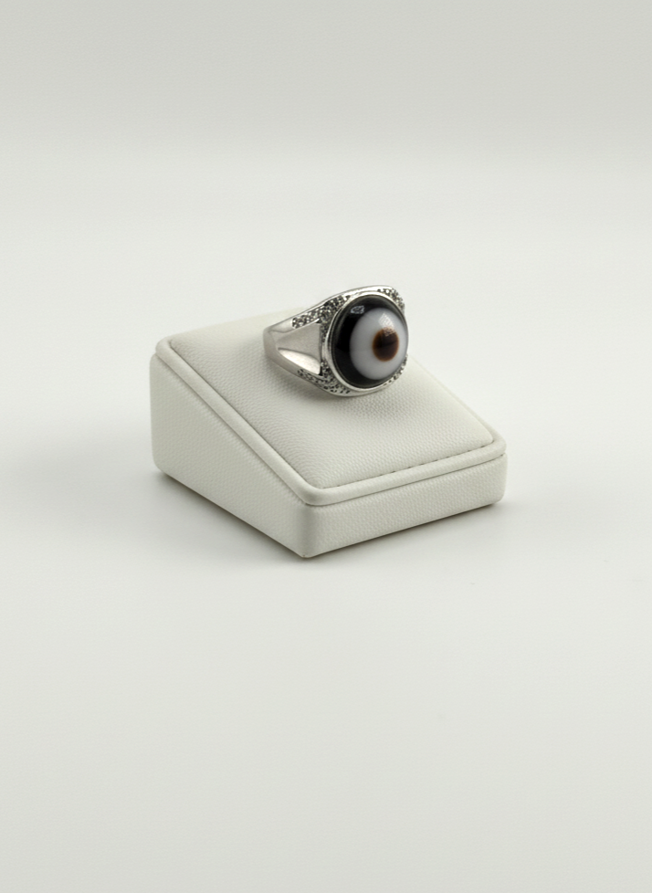 Natural evil eye Agate gemstone ring displayed on prop