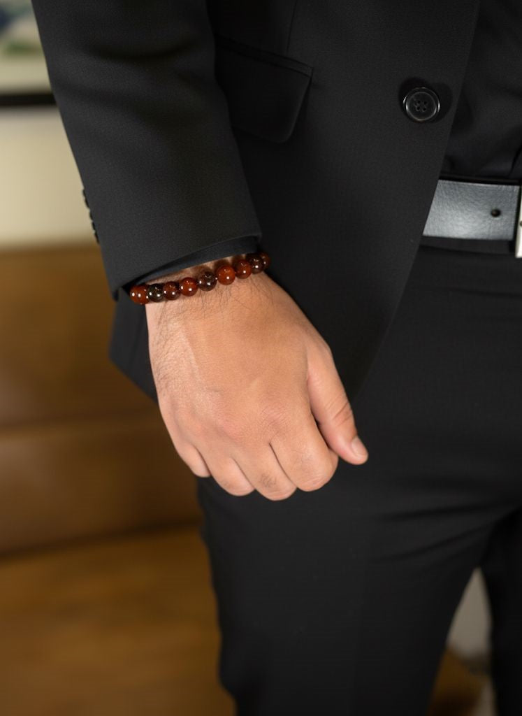 polished red tiger eye beads on wrist