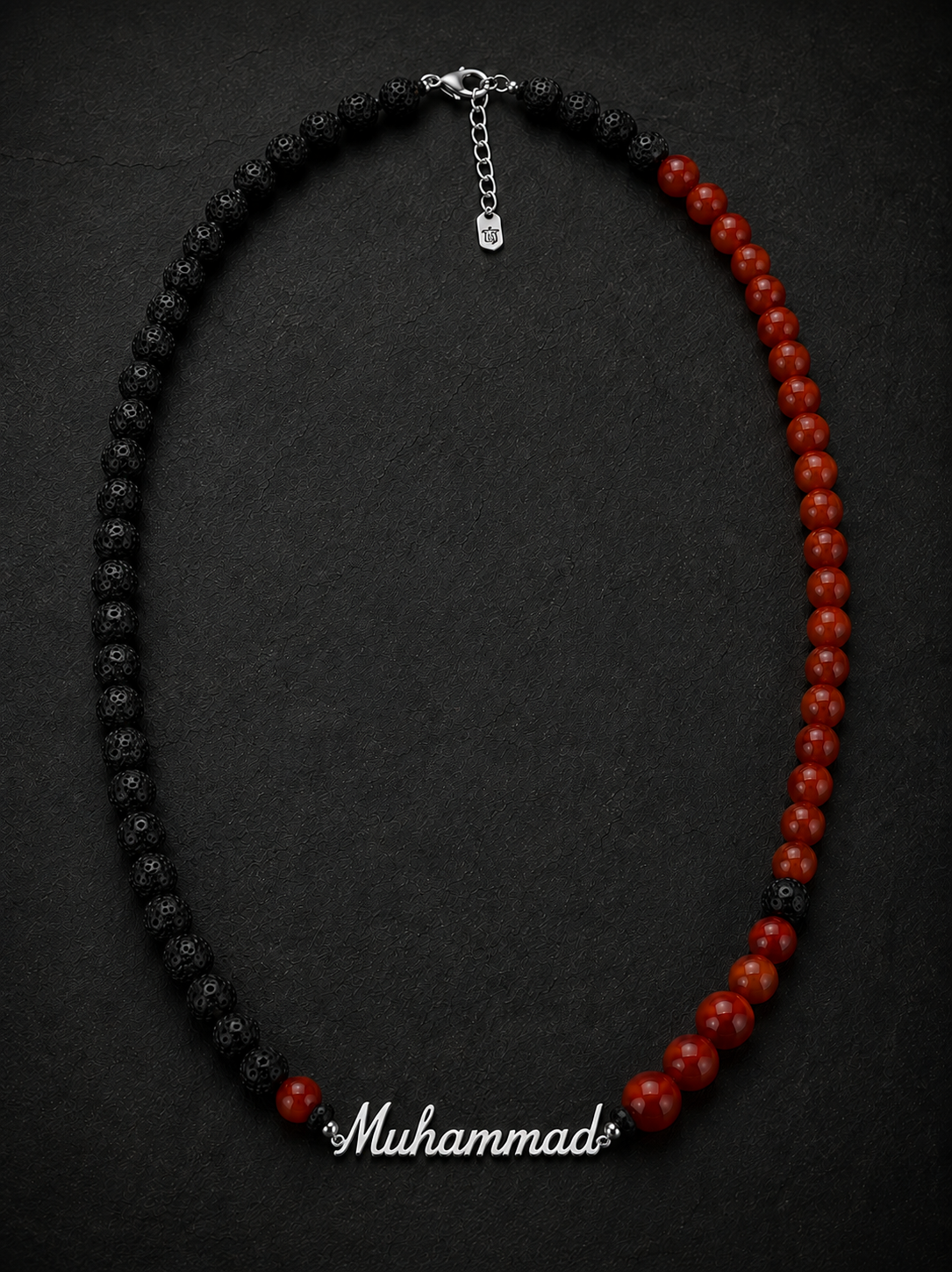 Necklace with black and red beads on a dark background