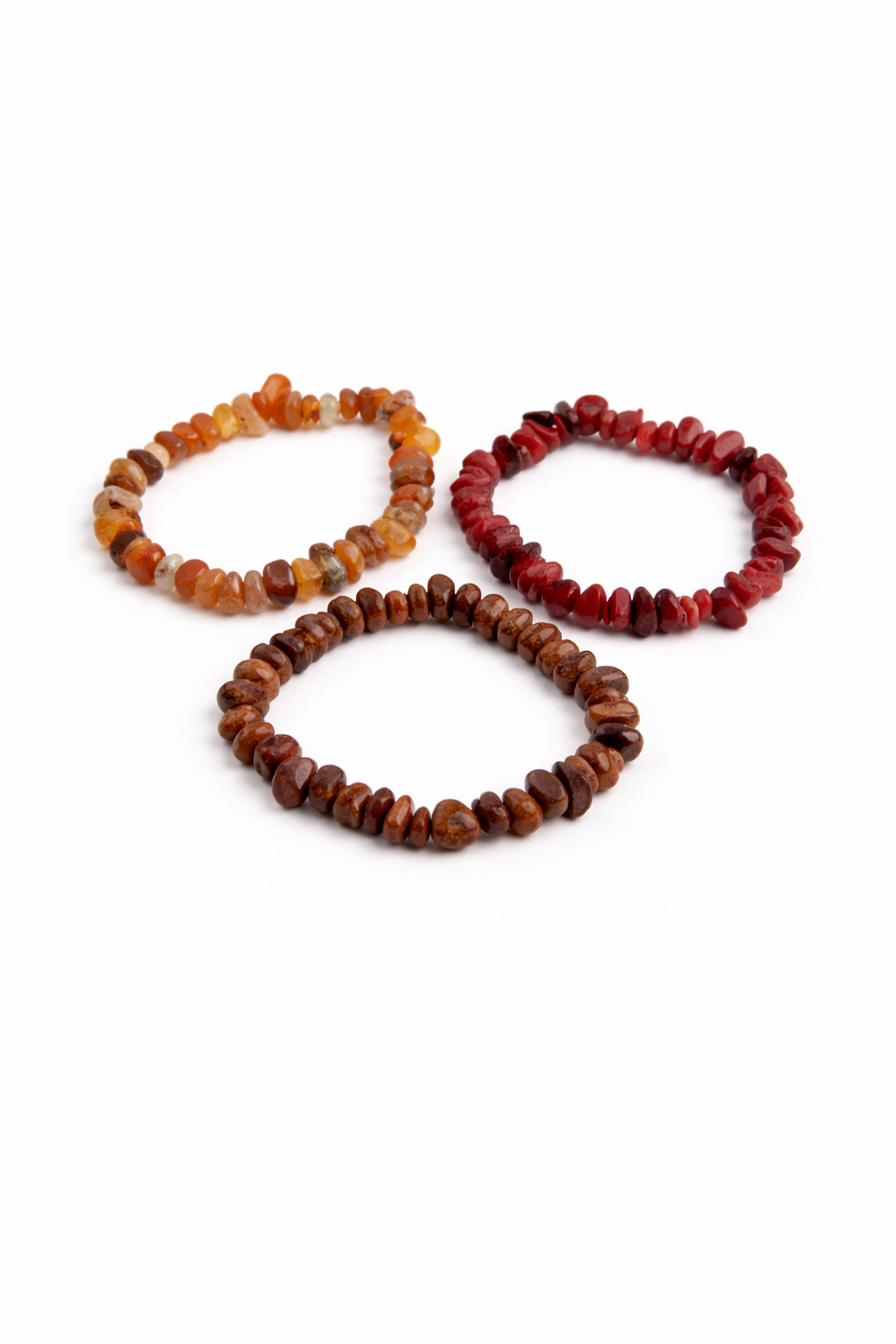 Three beaded bracelets in different colors on a white background