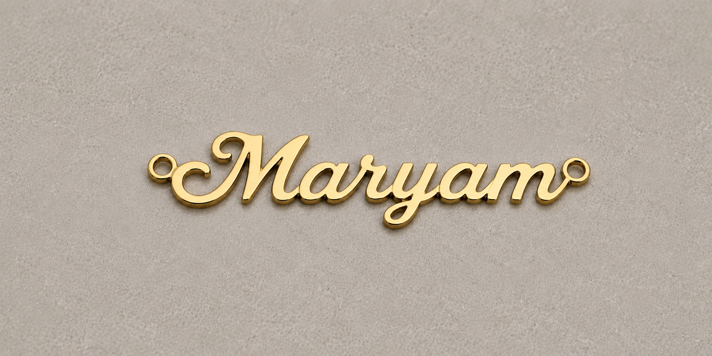 Gold nameplate with 'Maryam' on a beige background