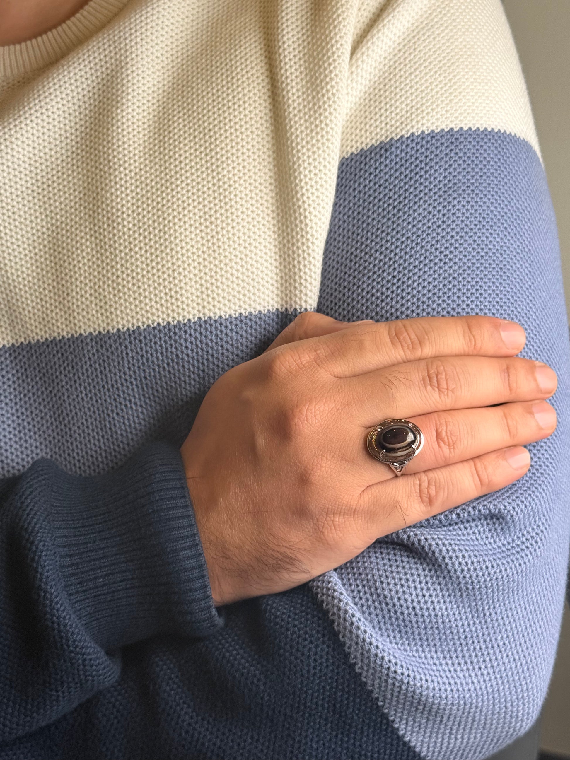 Close up of Turquoise stone ring on a man’s hand