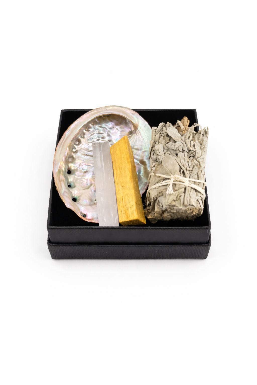 Sage smudge kit with crystal, wooden stick, and sage in a black box on a white background