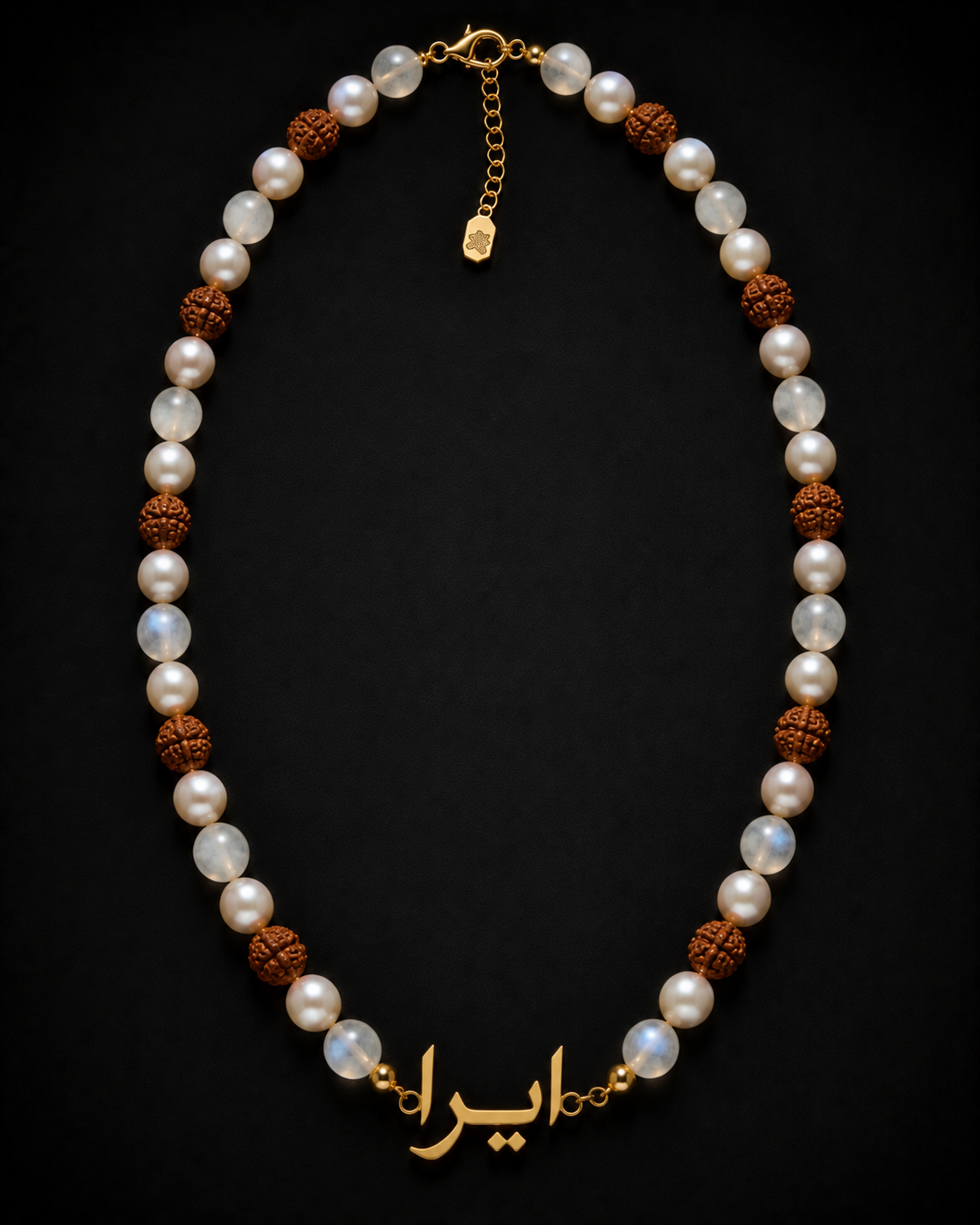 Necklace with pearls and brown beads on a black background