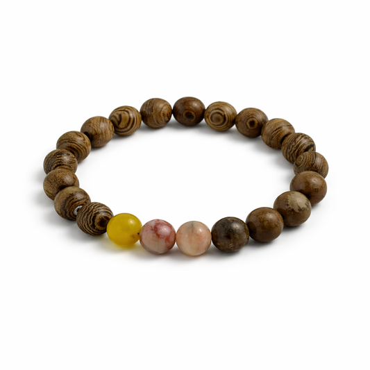 Wooden beaded bracelet with a yellow and pink bead on a white background