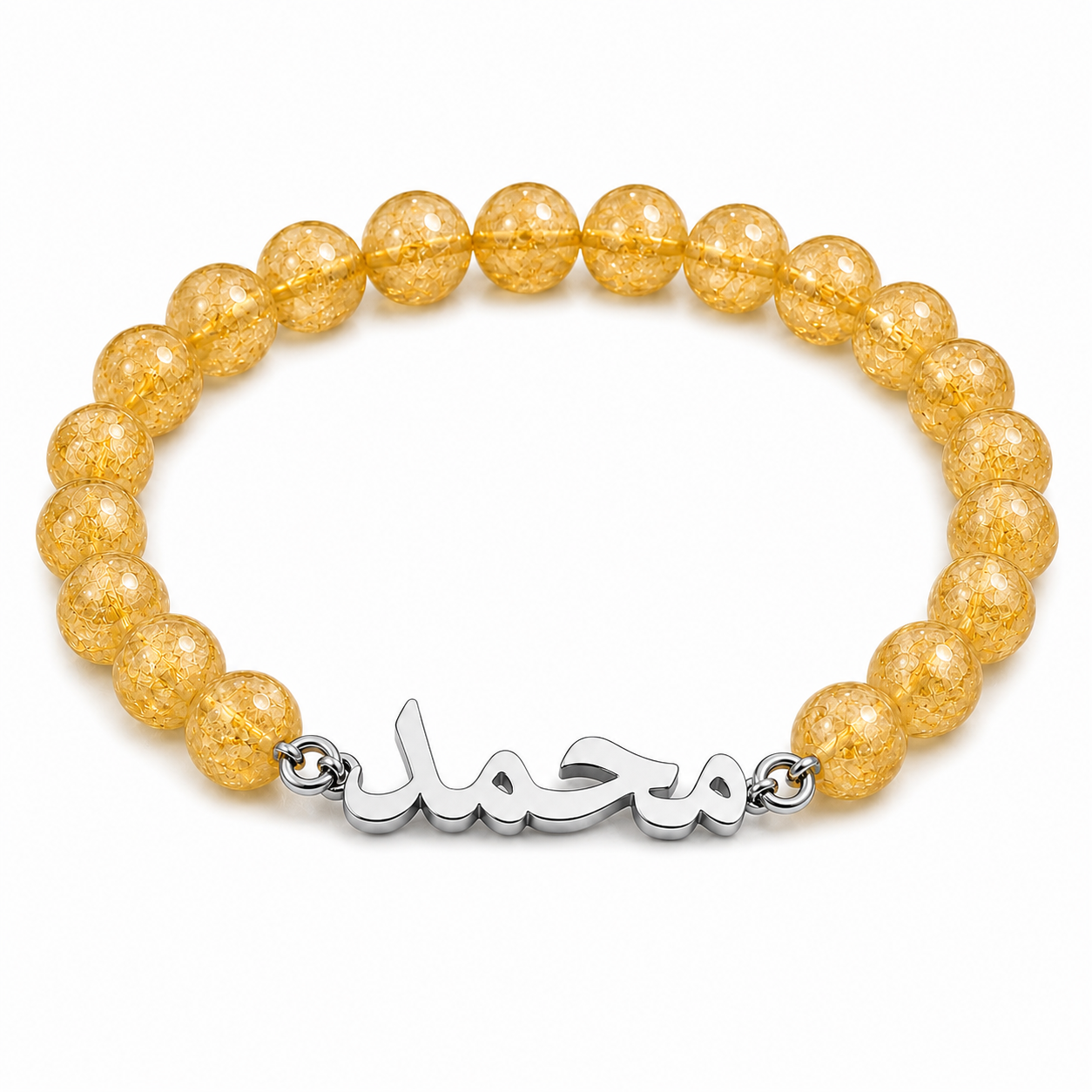 Yellow beaded bracelet with a silver charm on a white background