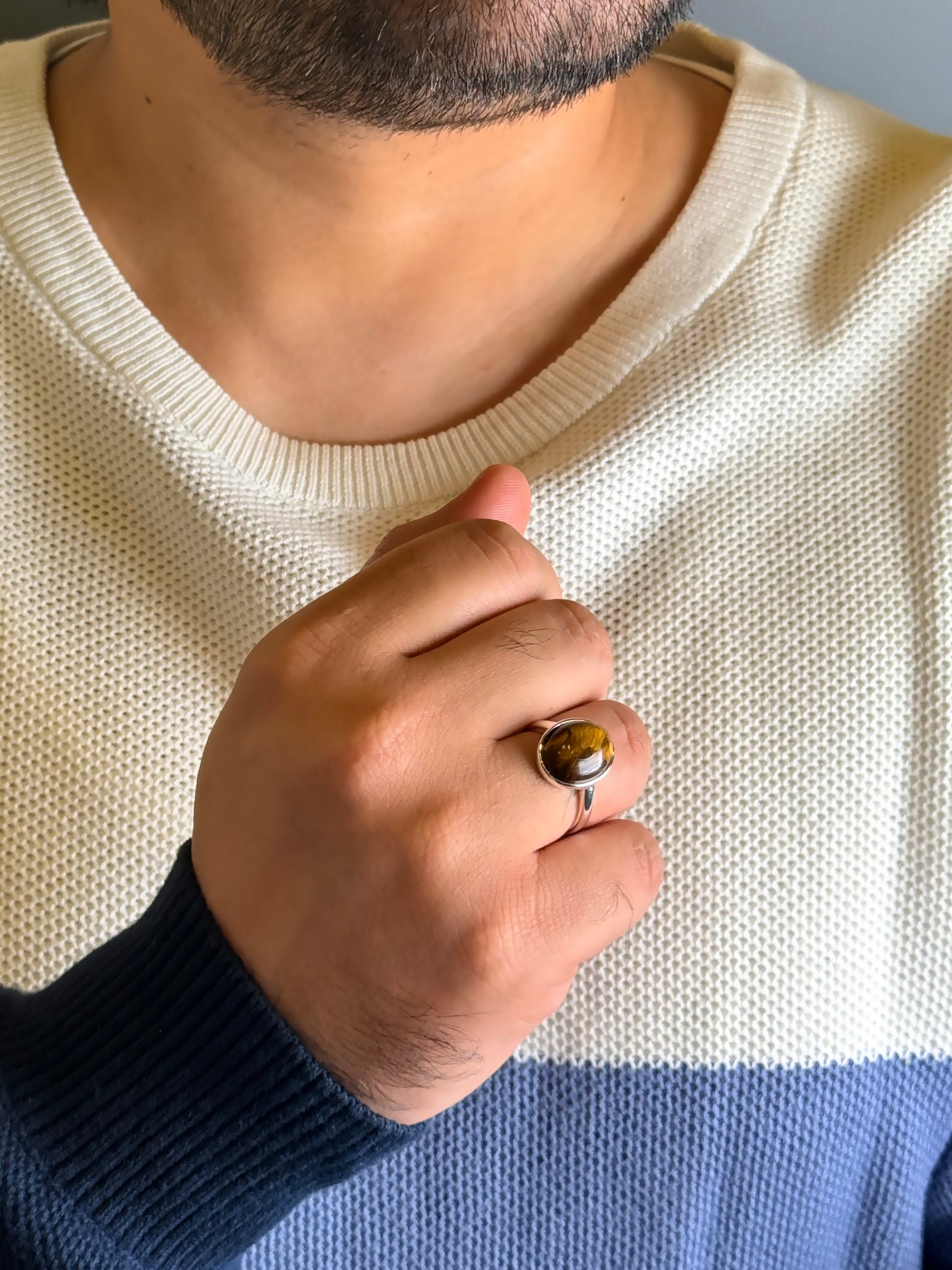 Man wearing natural Tiger Eye male ring in silver finish