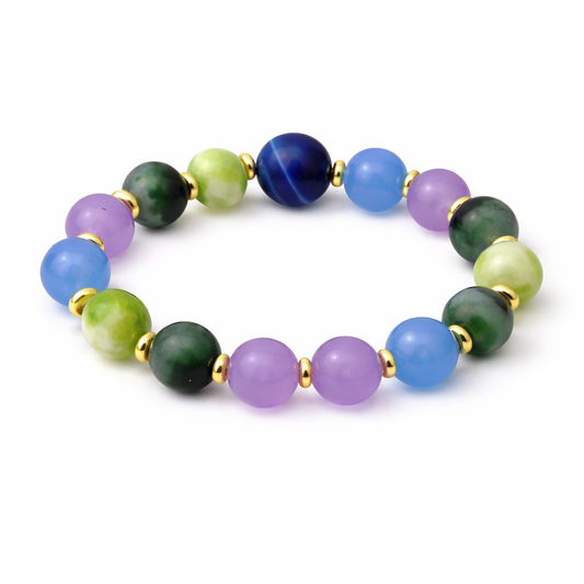 Multicolored beaded bracelet with gold accents on a white background