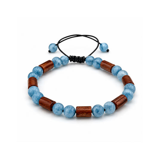 Bracelet with blue beads and wooden accents on a white background