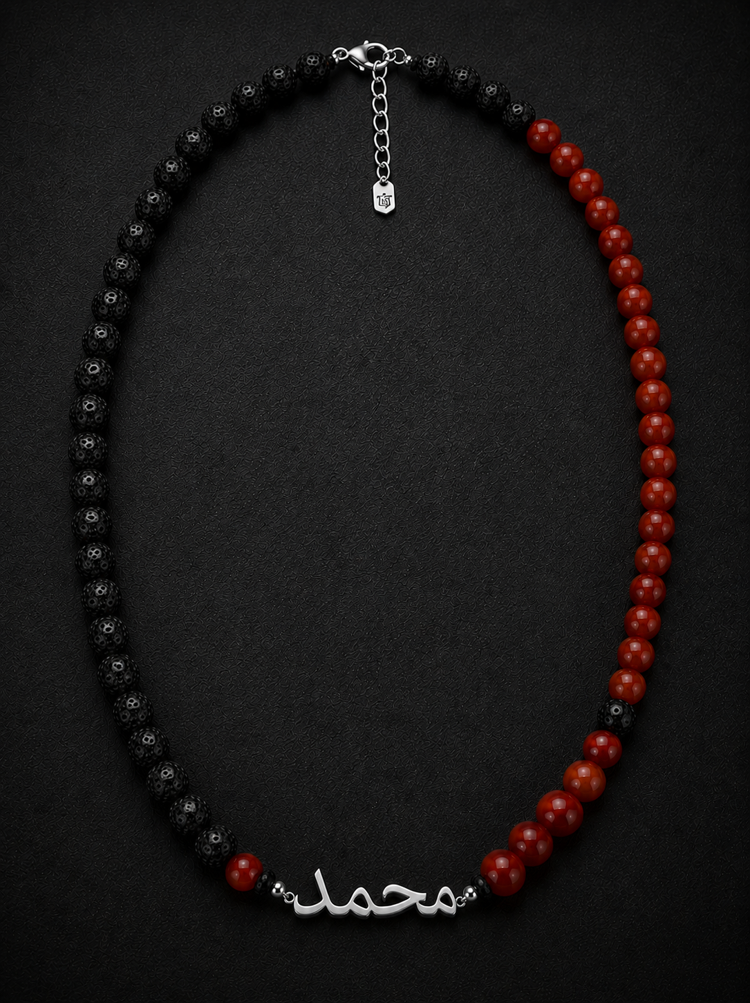 Necklace with black and red beads on a dark background