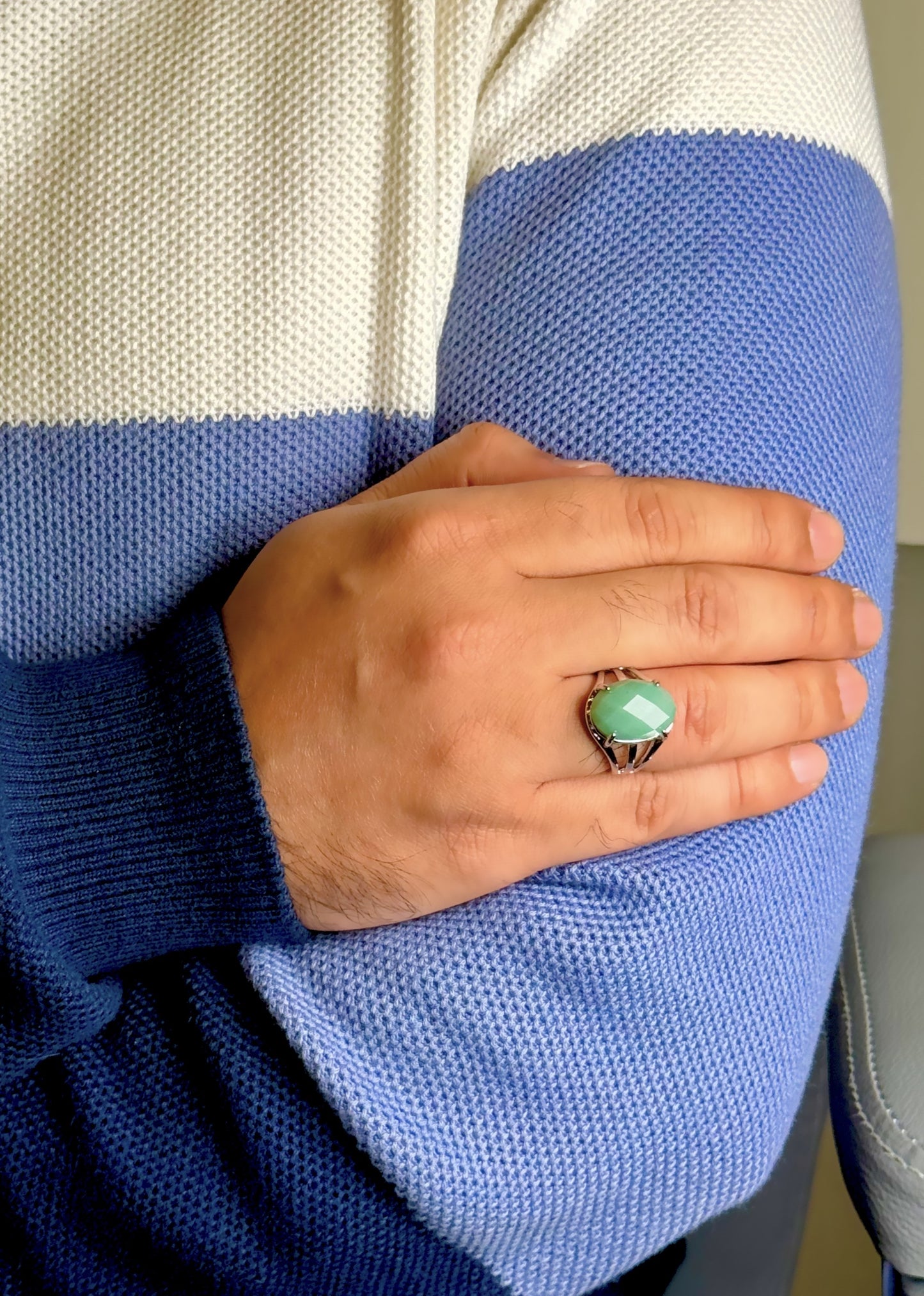 Close up of Amazonite gemstone ring on a man’s hand