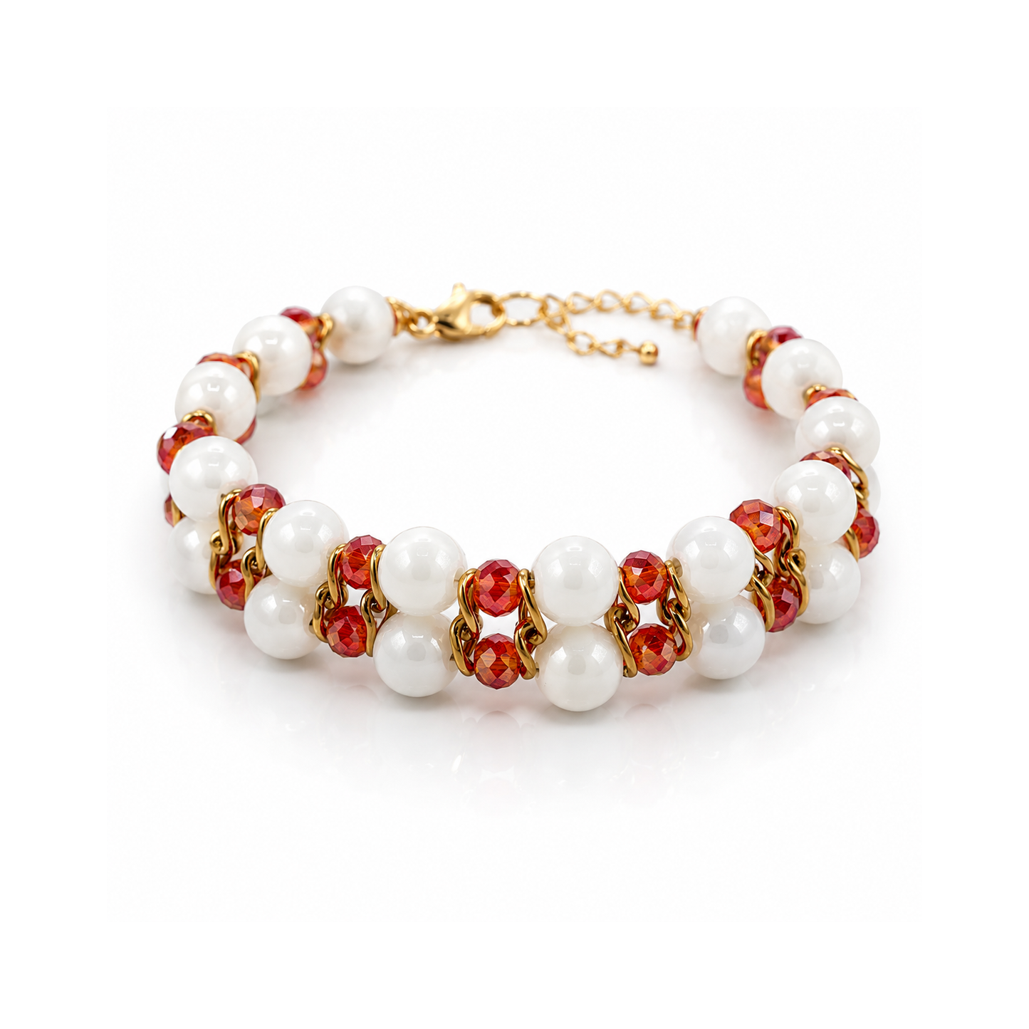 Bracelet with white pearls, red stones, and gold accents on a white background