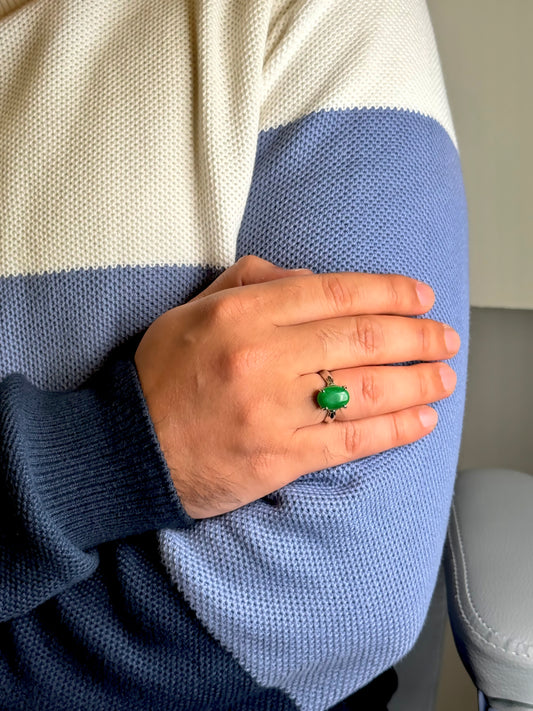 Close up of Green Aventurine gemstone ring on a man’s hand