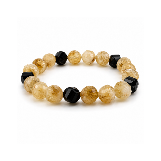Bracelet with alternating black and beige beads on a white background