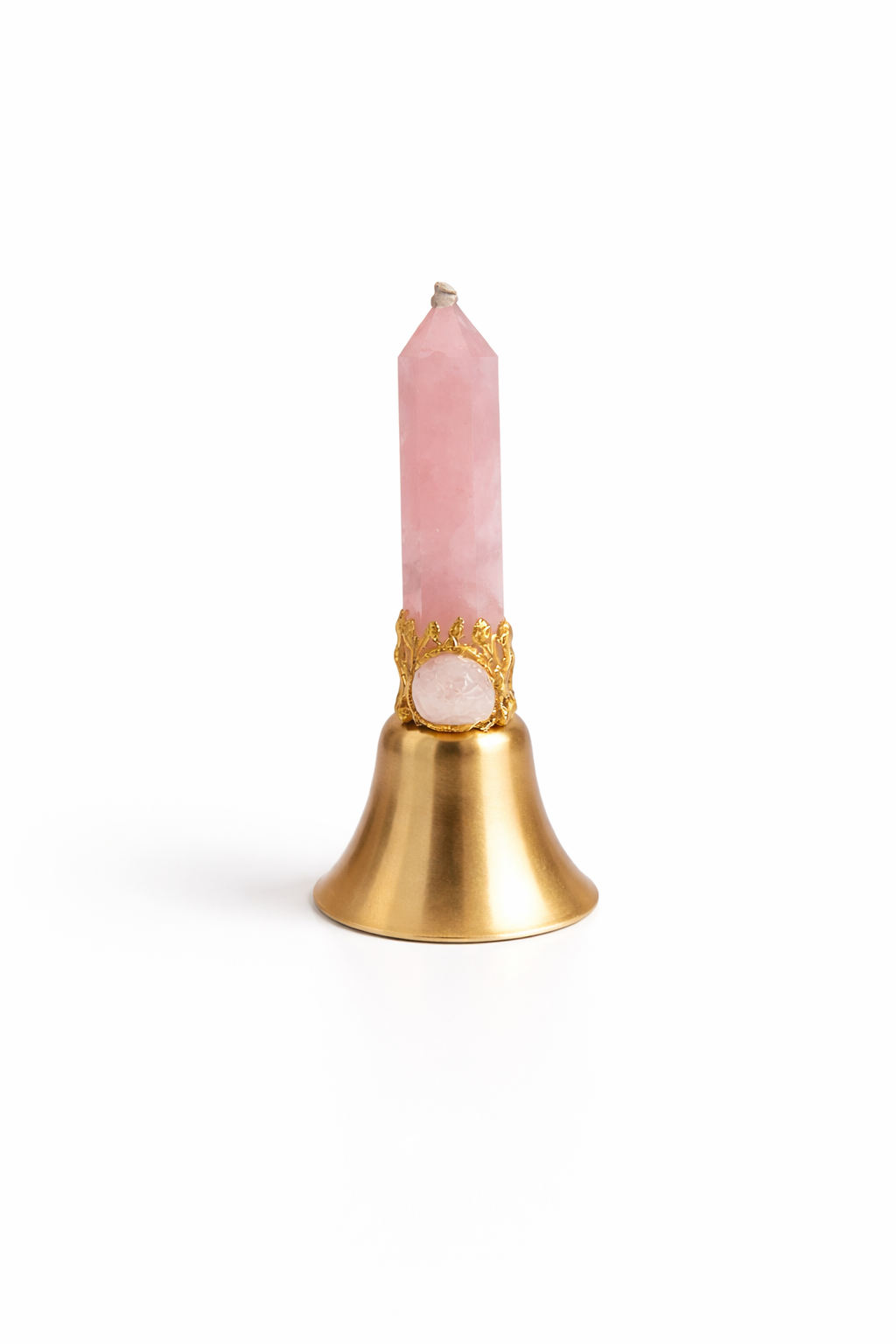 Pink candle in a gold holder on a white background