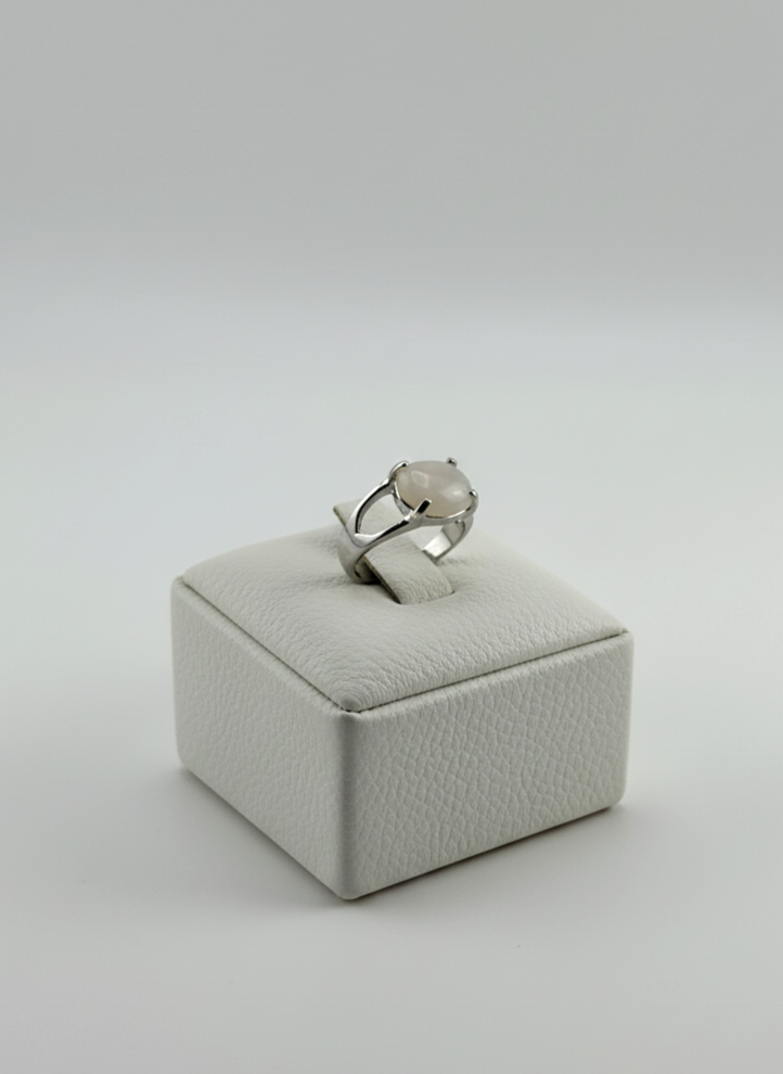 Natural White Agate stone ring displayed on prop