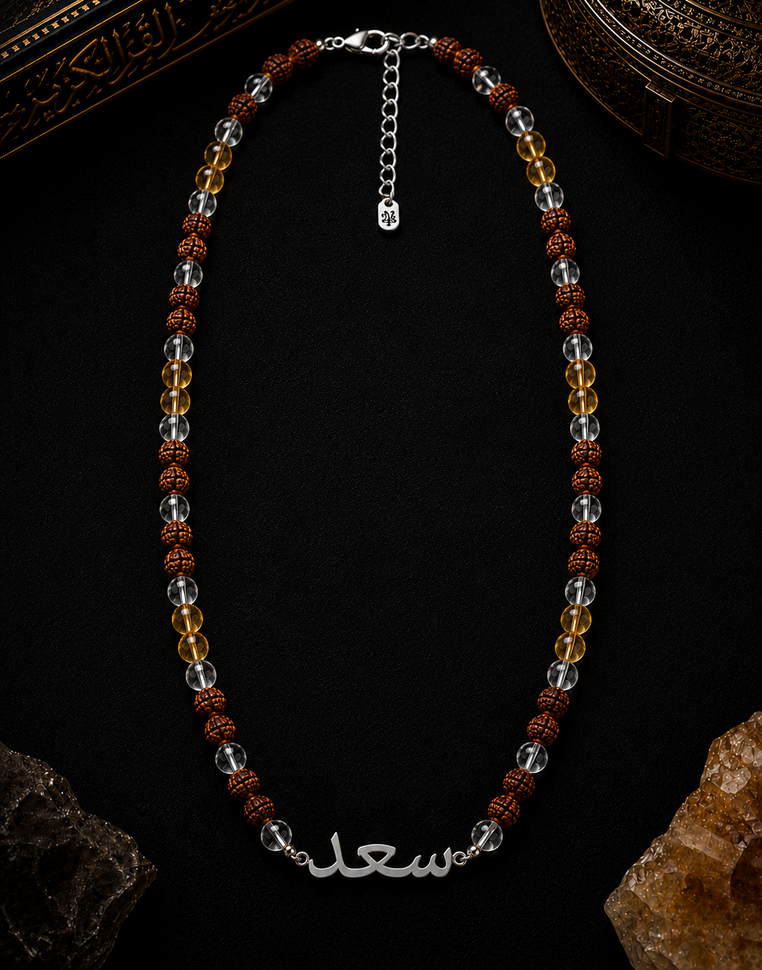 Necklace with beads and a clasp on a dark background