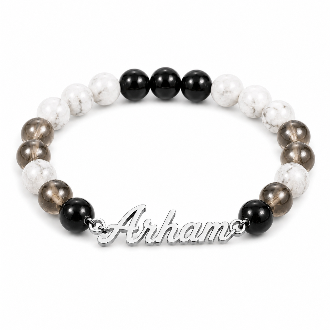 Bracelet with black, white, and brown beads and 'Arhams' clasp on a white background