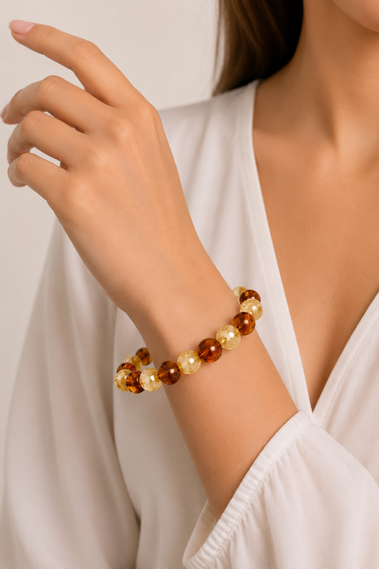 Close-up of a person wearing a beaded bracelet on a plain background