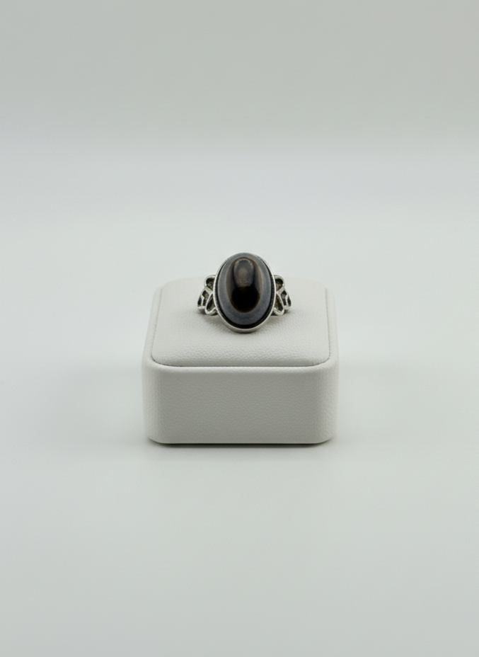 Natural Black Agate stone ring displayed on prop