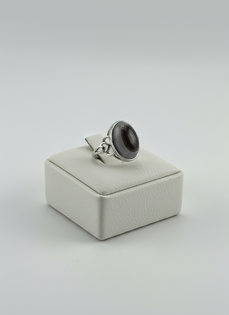 Natural Black Agate stone ring displayed on prop