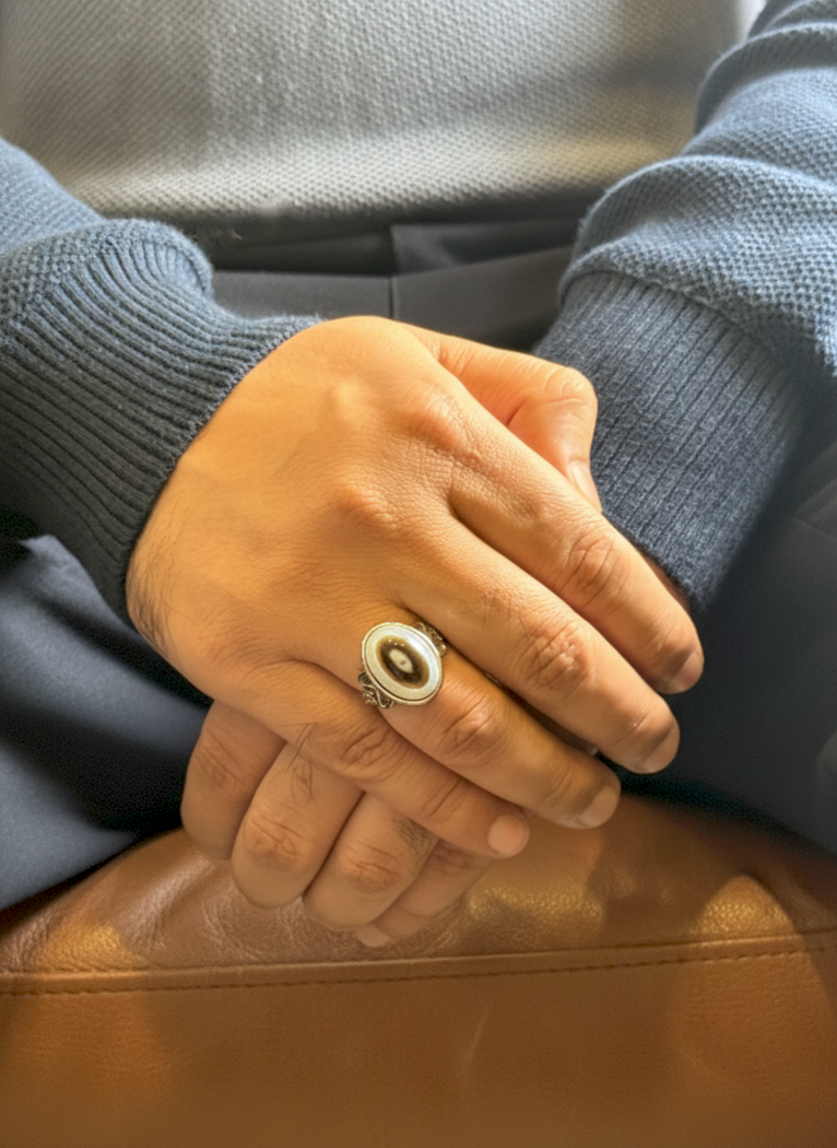 Close up of Black Agate gemstone ring on a man’s hand