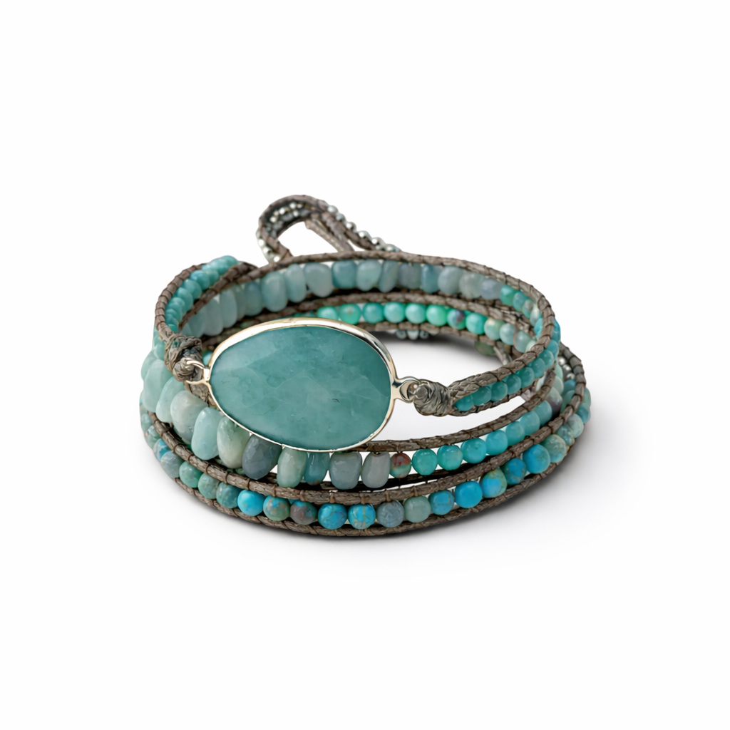 Turquoise beaded wrap bracelet with a central stone on a white background