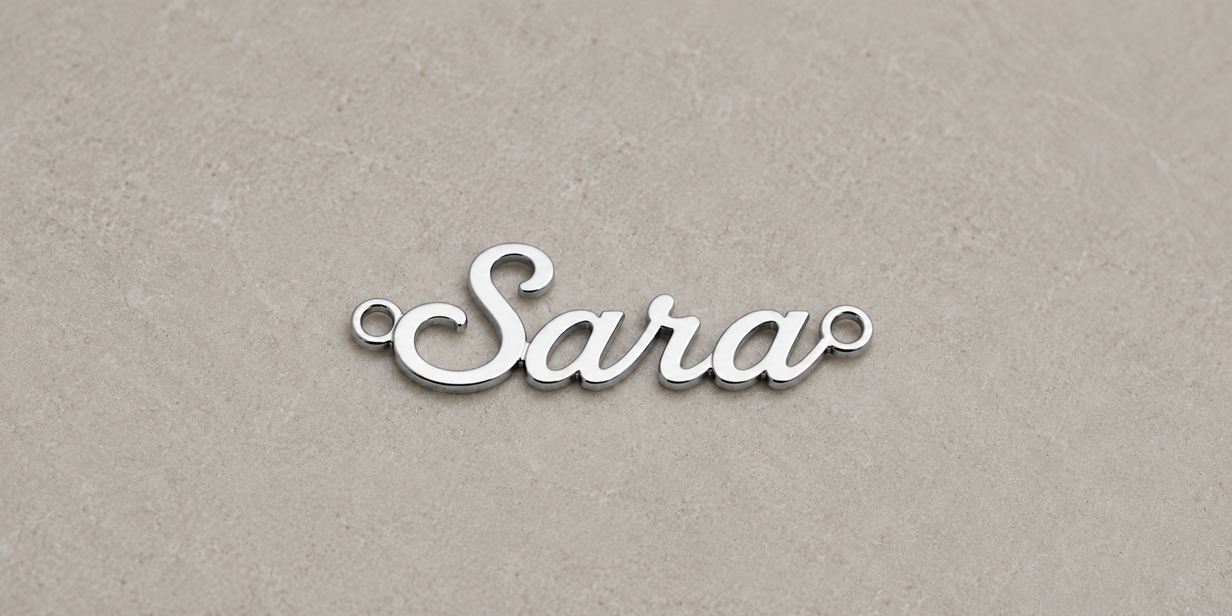 Silver 'Sara' nameplate on a beige background