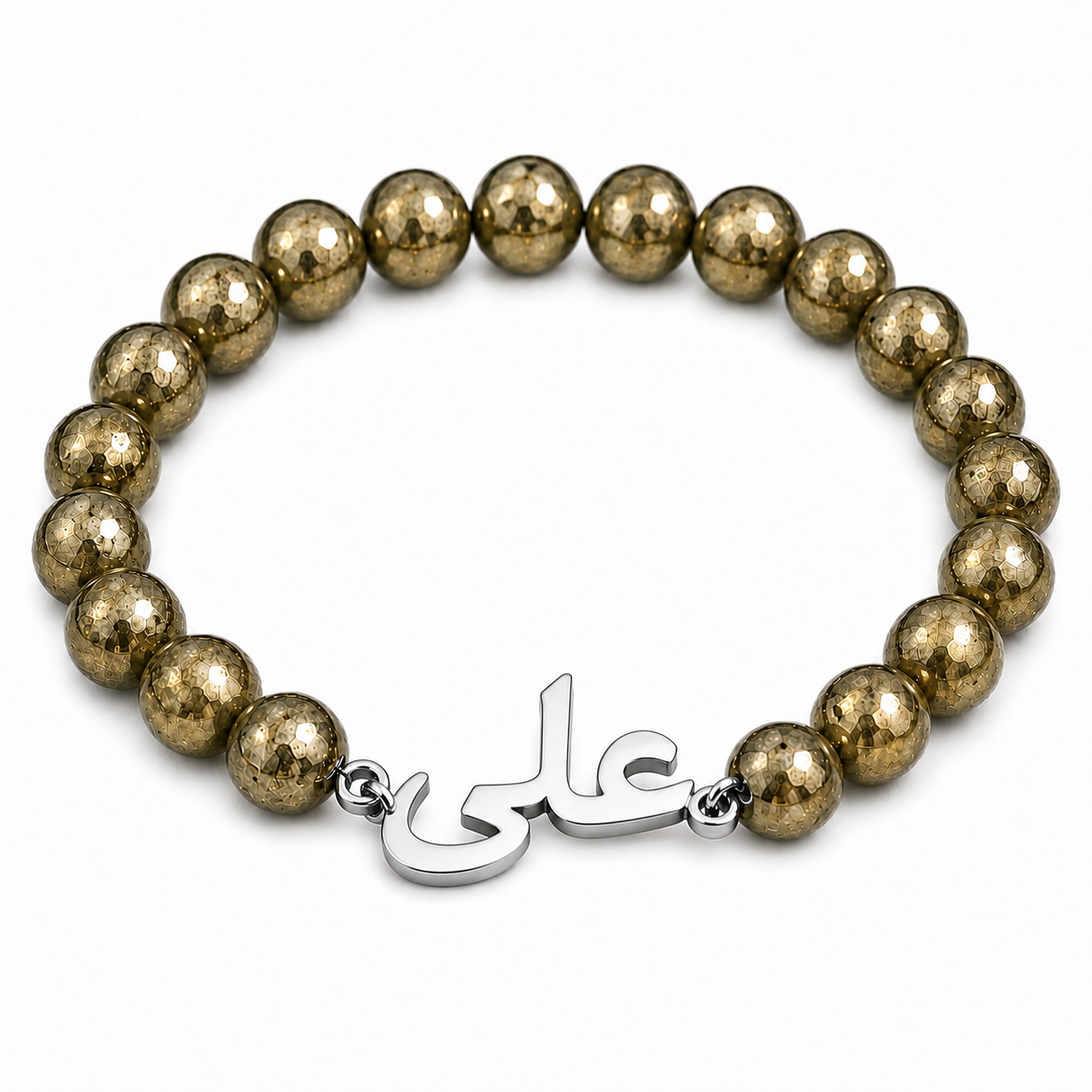 Bracelet with gold beads and a silver charm on a white background